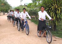 The FLOW children receive care, school supplies, school uniform, and bicycle to go to school.
